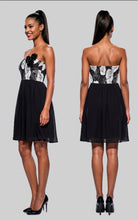 Load image into Gallery viewer, Black and white floral dress shown from front and back on a model against a gray background